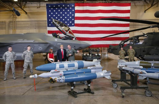 President Trump and Rep. Martha McSally are shown munitions during a defense capability and round-table tour at Luke Air Force Base in Glendale on October 19, 2018.