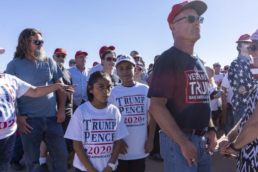 Supporters of President Donald Trump stand in a long line to watch the president's speech supporting Martha McSally at Phoenix-Mesa Gateway Airport on Oct. 19, 2018.