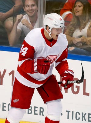 Red Wings right wing Gustav Nyquist celebrates after scoring the winning goal in overtime Saturday night.