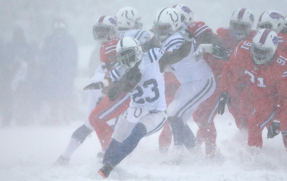 Indianapolis Colts running back Frank Gore (23) gets a first down against the Buffalo Bills in the first quarter at New Era Field in Orchard Park, N.Y., on Sunday, Dec. 10, 2017.