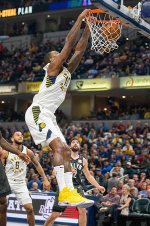 Oct 20, 2018; Indianapolis, IN, USA; Indiana Pacers center Kyle O'Quinn (10) slam dunks the ball in the second quarter against the Brooklyn Nets at Bankers Life Fieldhouse. Mandatory Credit: Trevor Ruszkowski-USA TODAY Sports