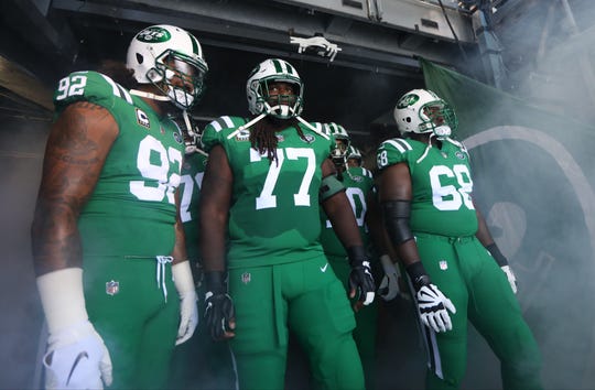 Leonard Williams, James Carpenter and Kelvin Beachum get ready to lead the Jets onto the field. Sunday, October 21, 2018