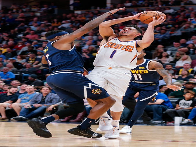 Oct 20, 2018; Denver, CO, USA; Denver Nuggets forward Torrey Craig (3) guards Phoenix Suns guard Devin Booker (1) in the third quarter at the Pepsi Center. Mandatory Credit: Isaiah J. Downing-USA TODAY Sports