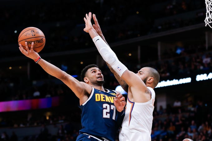Oct 20, 2018; Denver, CO, USA; Phoenix Suns center Tyson Chandler (4) defends against Denver Nuggets guard Jamal Murray (27) in the second quarter at the Pepsi Center. Mandatory Credit: Isaiah J. Downing-USA TODAY Sports