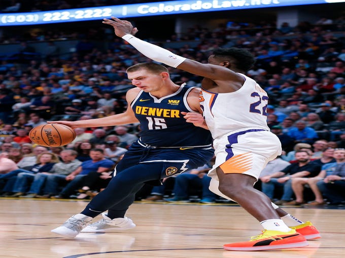 Oct 20, 2018; Denver, CO, USA; Phoenix Suns center Deandre Ayton (22) guards Denver Nuggets center Nikola Jokic (15) in the second quarter at the Pepsi Center. Mandatory Credit: Isaiah J. Downing-USA TODAY Sports