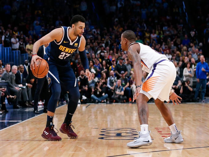 Oct 20, 2018; Denver, CO, USA; Phoenix Suns guard Isaiah Canaan (0) guards Denver Nuggets guard Jamal Murray (27) in the first quarter at the Pepsi Center. Mandatory Credit: Isaiah J. Downing-USA TODAY Sports