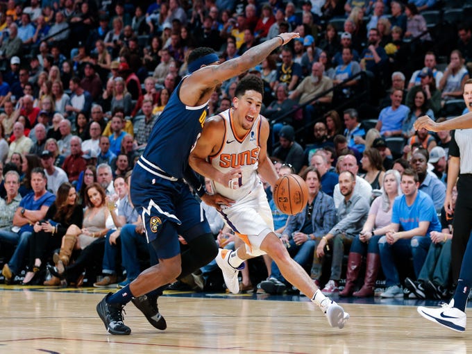 Oct 20, 2018; Denver, CO, USA; Denver Nuggets forward Torrey Craig (3) guards Phoenix Suns guard Devin Booker (1) in the third quarter at the Pepsi Center. Mandatory Credit: Isaiah J. Downing-USA TODAY Sports