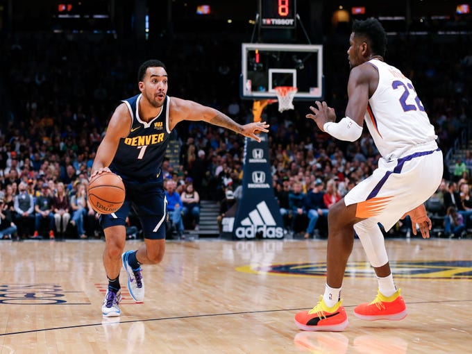Oct 20, 2018; Denver, CO, USA; Phoenix Suns center Deandre Ayton (22) guards Denver Nuggets forward Trey Lyles (7) in the second quarter at the Pepsi Center. Mandatory Credit: Isaiah J. Downing-USA TODAY Sports