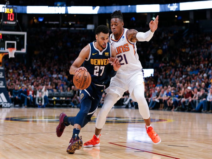 Oct 20, 2018; Denver, CO, USA; Phoenix Suns forward Richaun Holmes (21) guards Denver Nuggets guard Jamal Murray (27) in the second quarter at the Pepsi Center. Mandatory Credit: Isaiah J. Downing-USA TODAY Sports