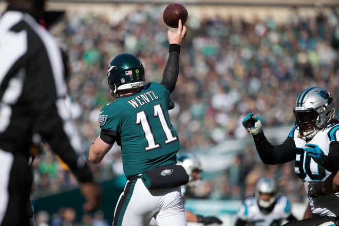 Eagles' Carson Wentz throws downfield Sunday at Lincoln Financial Field. 