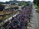 Honduran migrants take part in a caravan heading to the US on the road linking Ciudad Hidalgo and Tapachula, Chiapas state, Mexico, Oct. 21, 2018.Thousands of Honduran migrants resumed their march toward the United States on Sunday from the southern Mexican city of Ciudad Hidalgo, according to news reports. 