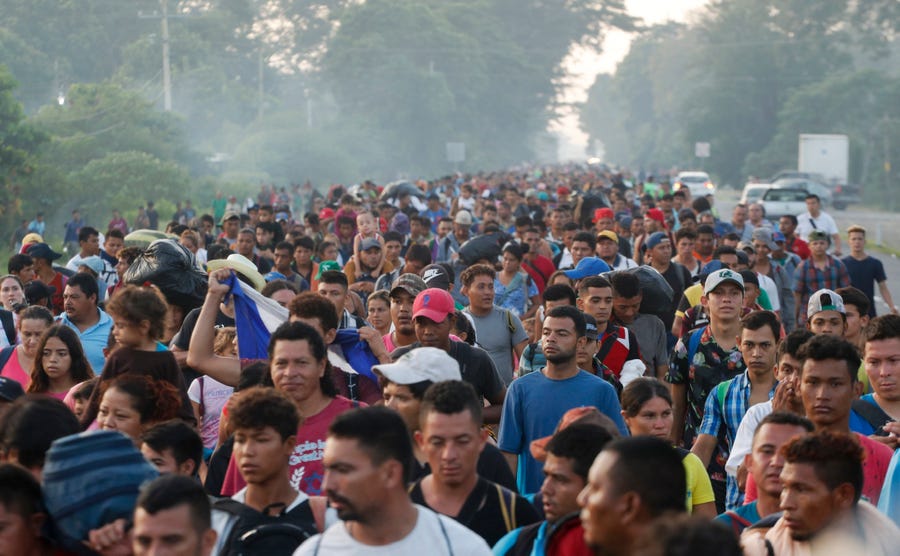 Central American migrants walking to the U.S. start their day departing Ciudad Hidalgo, Mexico, Sunday, Oct. 21, 2018.