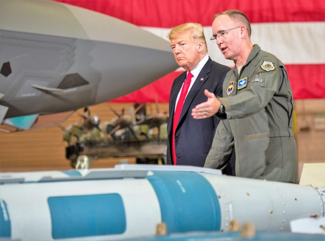 Brig. Gen. Todd Canterbury, 56th Fighter Wing commander briefs President Donald J. Trump about the capabilities of the GBU-12 bomb during his visit to Luke Air Force Base, Ariz., Oct. 19, 2018. After touring a static display of the F-35A Lightning II and other military equipment, Trump met with cabinet members, congressmen, and defense industry leaders in a roundtable discussion on current defense issues including cybersecurity, stealth technology, and F-35 development.