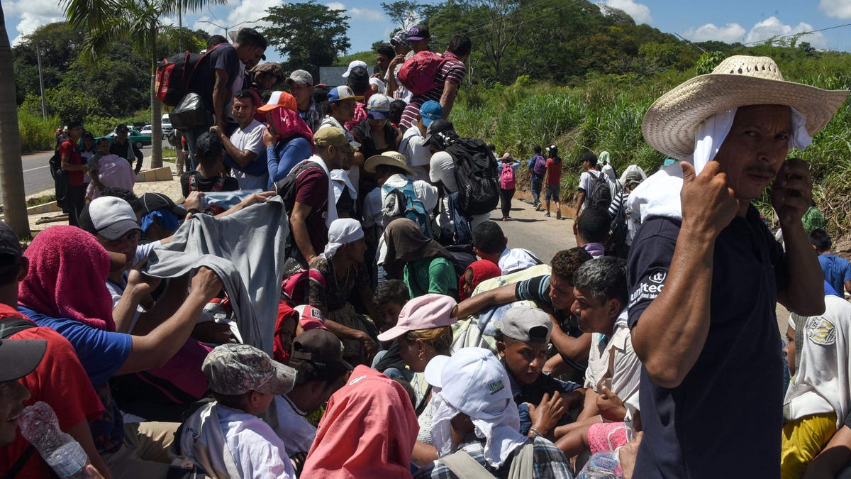 Honduran migrants take part in a caravan heading to the US, in the outskirts of Tapachula, on their way to Huixtla, Chiapas state, Mexico, on October 22, 2018.