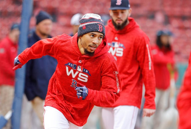 Red Sox right fielder Mookie Betts has been fielding ground balls to prepare for a possible return to second base.