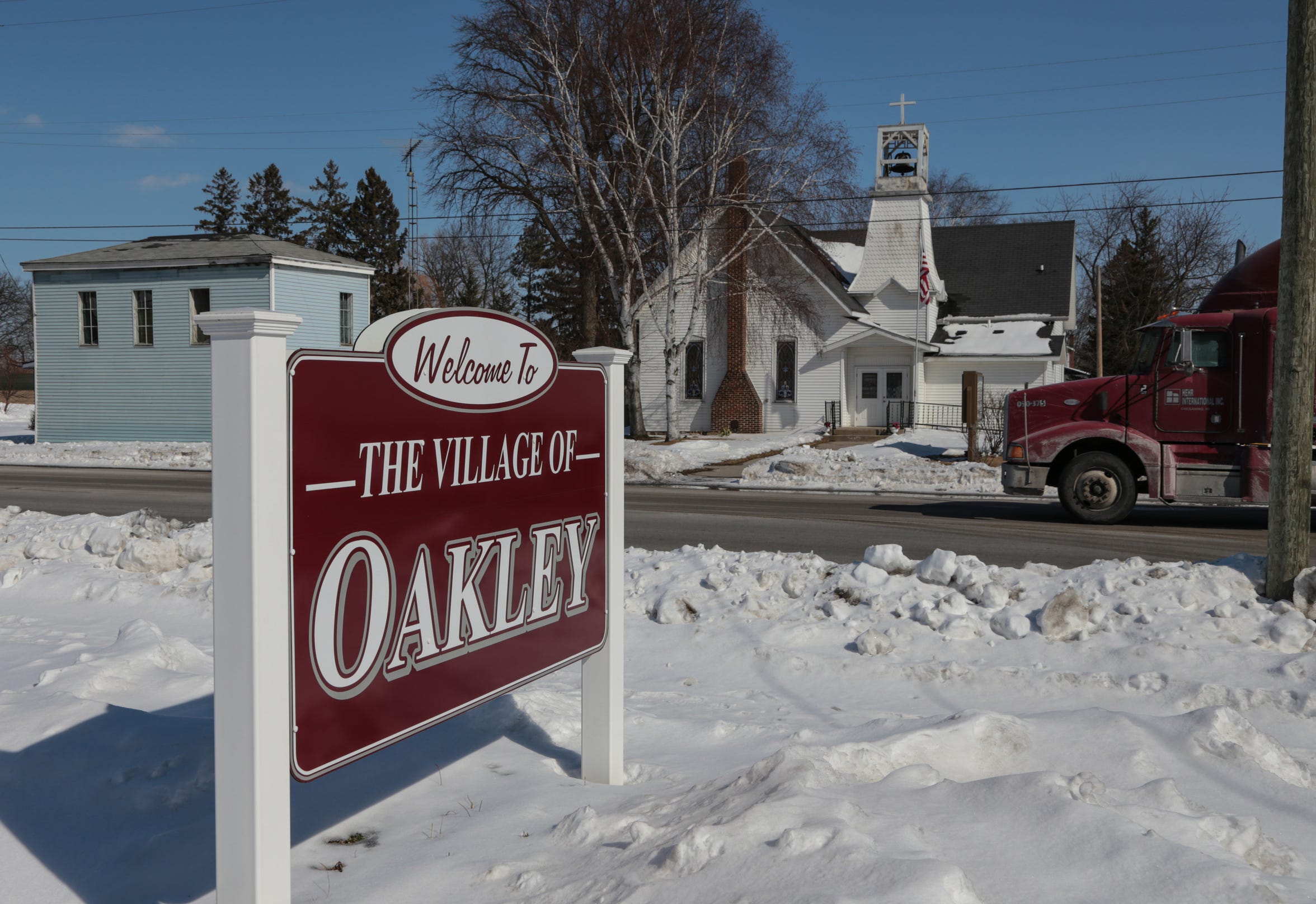 Traffic moves long Main Street in the village of Oakley, MI on Monday March 2, 2015. The small community once had nearly 150 reserve officers.