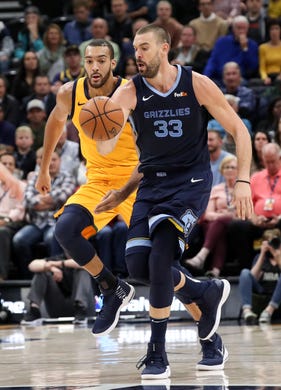 Oct 22, 2018; Salt Lake City, UT, USA; Memphis Grizzlies center Marc Gasol (33) dribbles the ball up the court with Utah Jazz center Rudy Gobert (27) looking to steal the ball during the second quarter at Vivint Smart Home Arena.