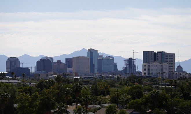 Construction cranes dot the downtown Phoenix skyline on Oct. 22, 2018.