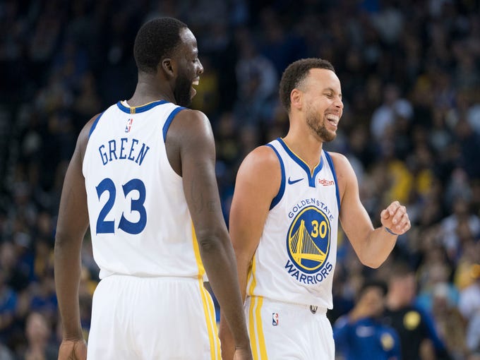 October 22, 2018; Oakland, CA, USA; Golden State Warriors forward Draymond Green (23) and guard Stephen Curry (30) laugh during the third quarter against the Phoenix Suns at Oracle Arena. Mandatory Credit: Kyle Terada-USA TODAY Sports