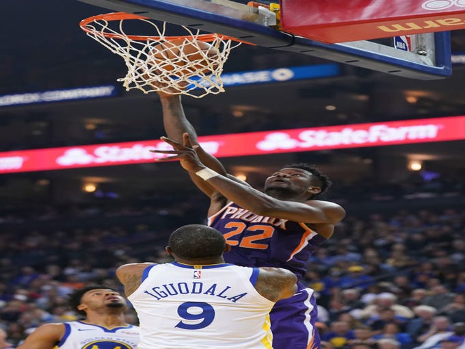 October 22, 2018; Oakland, CA, USA; Phoenix Suns center Deandre Ayton (22) shoots the basketball against Golden State Warriors guard Andre Iguodala (9) during the second quarter at Oracle Arena. Mandatory Credit: Kyle Terada-USA TODAY Sports