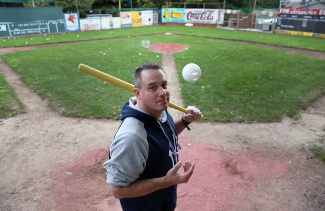Kevin Masters built his Wiffle Ball field of dreams in his Penfield backyard.  Masters has a Green Monster and other famous ball park features.