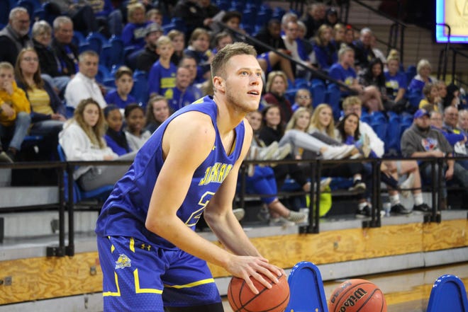 Mike Daum eyes the basket during the 3-point shooting contest at last week's Jackrabbit tip-off event at Frost Arena
