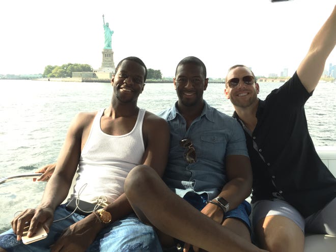 Brothers Marcus and Andrew Gillum and lobbyist/friend Adam Corey during a New York harbor boat ride with undercover FBI agents.
