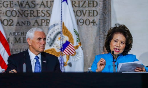 Vice President Mike Pence listens to U.S. Transportation Secretary Elaine Chao during a meeting of the National Space Council at the National War College at Fort McNair in Washington, D.C., on Oct. 23, 2018. Trump had recently proposed the creation of the U.S. Space Force, a sixth branch of the U.S. Armed Forces. 