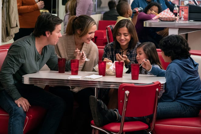 A married couple (Mark Wahlberg, far left, and Rose Byrne) adopt a a trio of foster siblings (Isabela Moner, Julianna Gamiz and Gustavo Quiroz) in the comedy "Instant Family."
