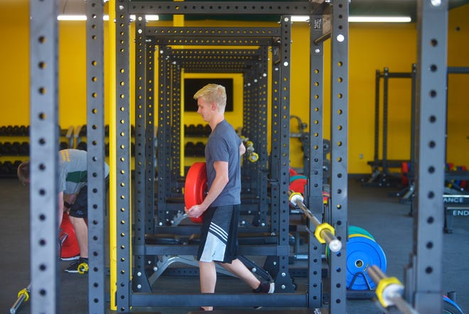 Ben Huotari a junior on the CMR swim team works out in the gym annex on Wednesday afternoon.