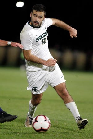 Michigan State defender John Freitag scored the game-winning goal two minutes into overtime to send the Spartans to the Sweet 16 with a 2-1 win over Louisville.