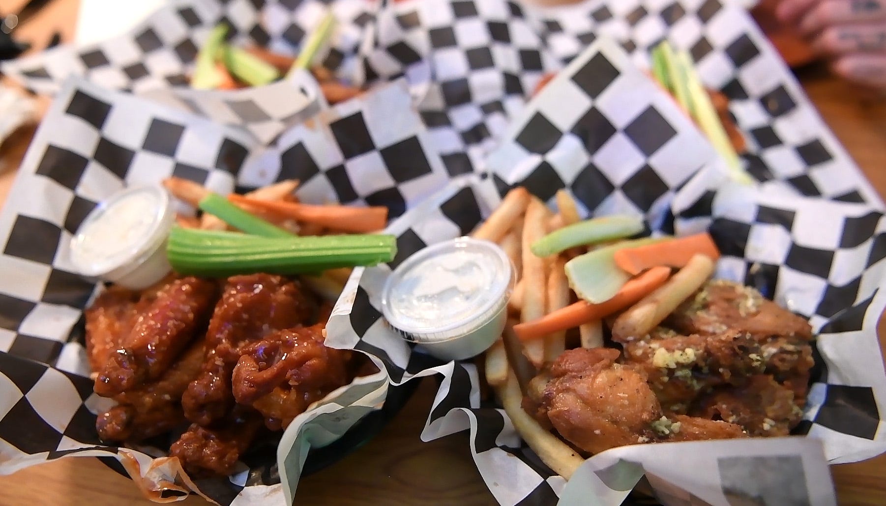 Thai chili wings (left) and Parmesan wings (right) at Sharky's Wings and Raw Bar in Clifton.