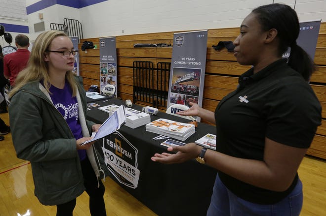 Oshkosh Corp. design engineer Maia Rivers, right, talks about being an engineer with Hannah Behling on Tuesday, Oct. 23, 2018, during the Oshkosh Chamber of Commerce's Career Exploration Fair at Oshkosh West High School. About 1,000 students from Oshkosh and Omro middle and high schools participated in this year's expanded fair, thanks to a $5,000 grant from AT&T.