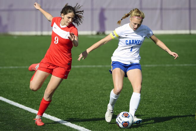 Carmel midfielder Ashley Witucki (1) controls the ball during their IHSAA 3A semistate soccer match against the Center Grove Trojans at Seymour High School in Seymour, Ind., on Saturday, Oct. 20, 2018.