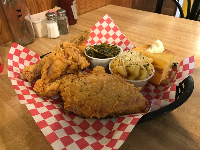 Broaster chicken with collard greens, smoked gouda and cheddar mac and cheese and cornbread at Fidler's on the Grand in Lansing.