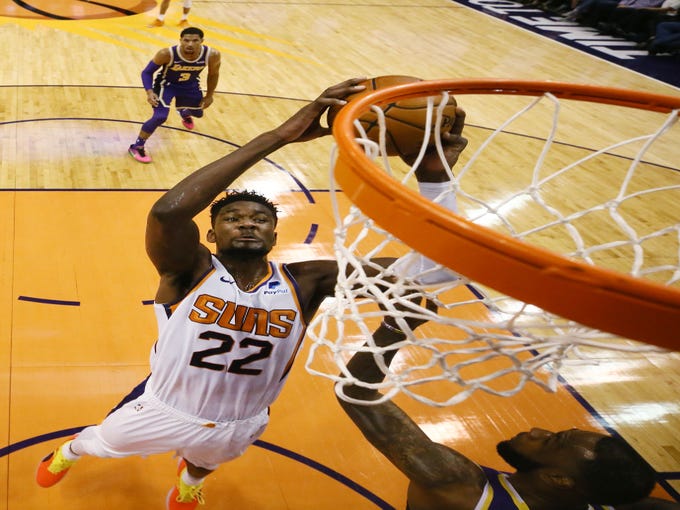 Phoenix Suns' Deandre Ayton scores against the Los Angeles Lakers during a game on Oct. 24 at Talking Stick Resort Arena.