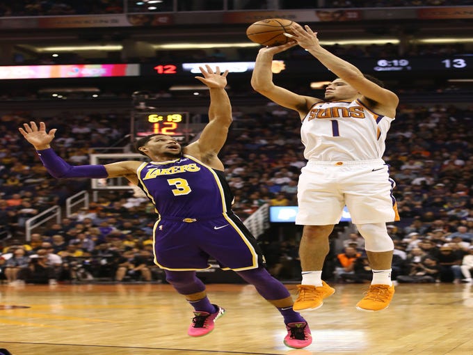 Phoenix Suns' Devin Booker shoots a jumper against the Los Angeles Lakers in the first half during a game on Oct. 24 at Talking Stick Resort Arena.