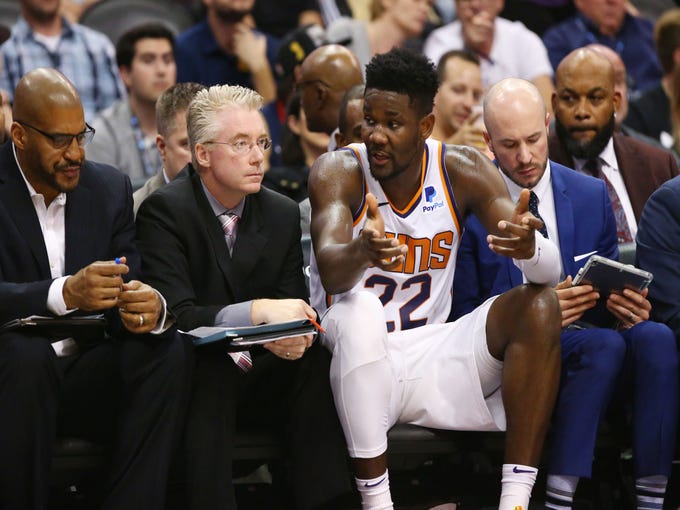 Phoenix Suns' Deandre Ayton sits with the coaches against the Los Angeles Lakers in the second half during a game on Oct. 24 at Talking Stick Resort Arena.