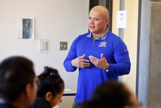 Adrian Lewis, security supervisor at Diné College, talks to students and staff members about active-shooter incidents during a training session on Friday at the college's south campus in Shiprock.