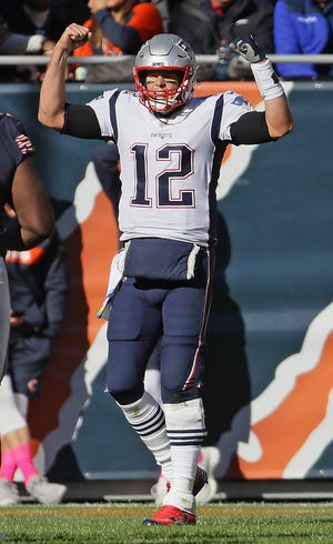 New England Patriots quarterback Tom Brady celebrates a long gain during last Sunday's win over the Chicago Bears.