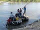 Border crossers from Guatemala, use a raft at cross the border into Mexico at Cuidad Hidalgo on Oct. 25, 2018.