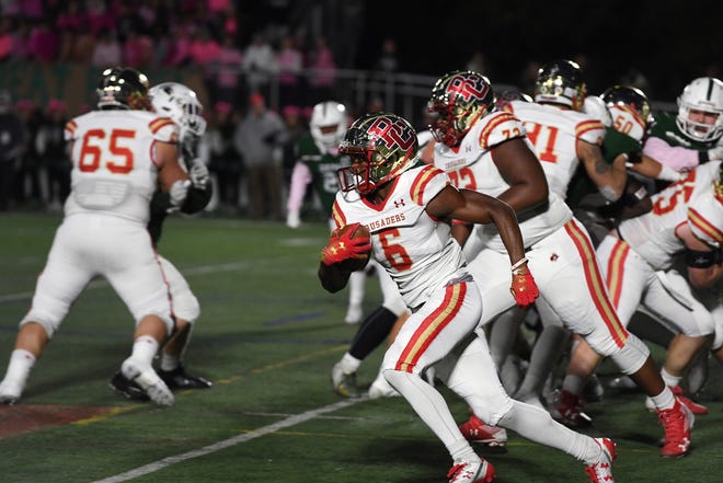 Bergen Catholic football at DePaul on Friday, October 26, 2018.  BC #6 Rahmir Johnson on his way to scoring a touchdown in the first quarter.