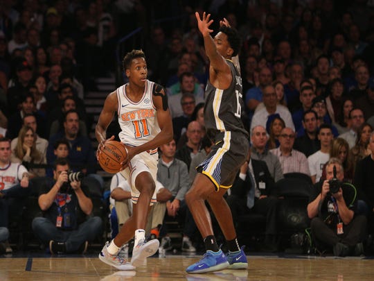 October 26, 2018; New York, NY, USA; New York Knicks goaltender Frank Ntilikina (11) will be trying to beat 15-year-old Golden State Warriors center Damian Jones in the first quarter at Madison Square Garden.