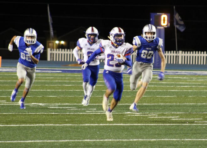 Las Cruces' Ricky Clark runs after intercepting Carlsbad's Mason Estrada in the first half. Clark would return the interception to the one-yard line.