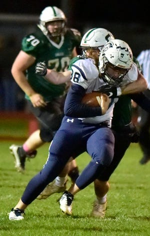 Chambersburg's Garner Funk (88) carries the ball after a catch for the Trojans during the Carlisle game on Friday, October 26, 2018.