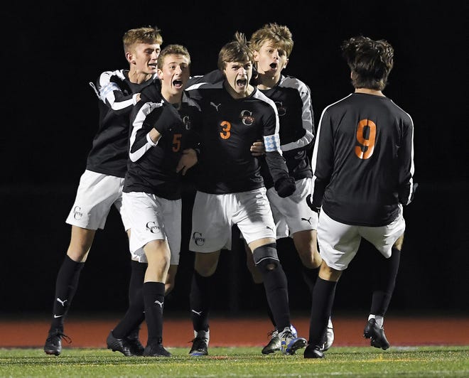 Churchville-Chili's Colby Egan (3) celebrates his goal with teammates during a Class A sectional semifinal against Wayne played at Hilton High School, Friday, Oct. 26, 2018. No. 1 seed Churchville-Chili advanced to the Class A final with a 3-2 win over No. 4 seed Wayne.