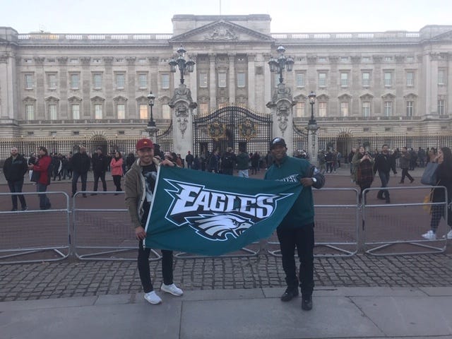 Eagles fan John Williams, right, standing in front of Buckingham Palace, flew in from California to watch the Eagles play Sunday.