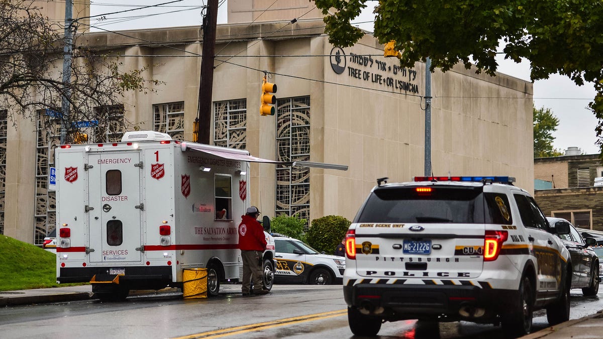 Police outside and a disaster response team outside the Tree of Life Congregation in the Squirrel Hill neighborhood of Pittsburgh.