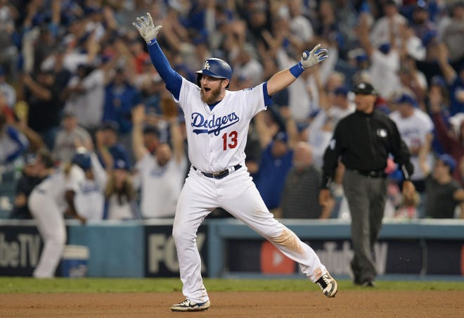 Los Angeles Dodgers first baseman Max Muncy celebrates after hitting a solo home run against the Boston Red Sox in the 18th inning in Game 3 of the 2018 World Series at Dodger Stadium.