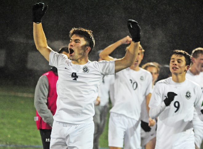 St. Augustine's Anthony Trotto (right) and his teammates celebrate the Prep's 2-1 victory over Washington Township in the South Jersey Coaches Association soccer tournament championship game on Saturday, October 27, 2018.